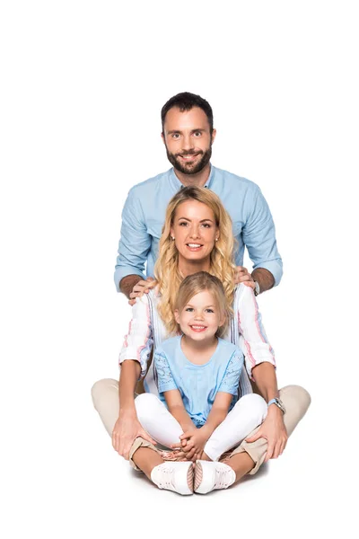 Smiling parents with daughter looking at camera isolated on white — Stock Photo