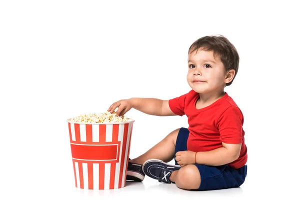 Happy boy with popcorn isolated on white — Stock Photo