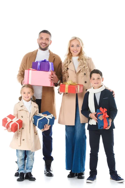 Stylish parents and adorable kids holding presents, isolated on white — Stock Photo