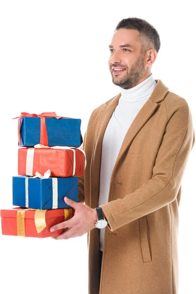 Handsome man holding gifts, isolated on white — Stock Photo