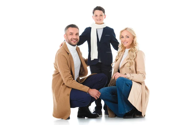 Glückliche Familie beim Umarmen mit Sohn im Herbst-Outfit, isoliert auf weiß — Stockfoto