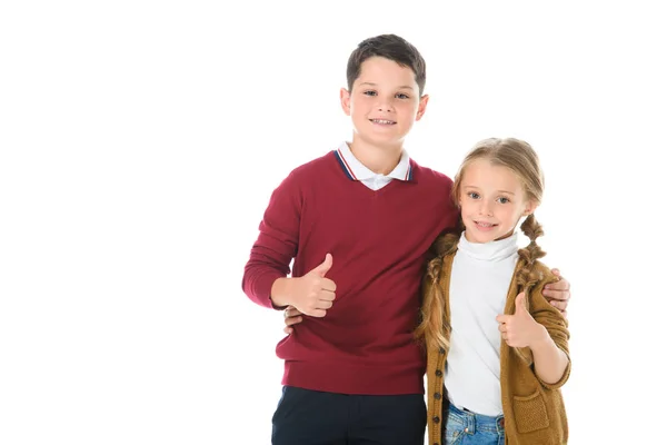 Siblings hugging and showing thumbs up, isolated on white — Stock Photo