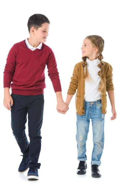 Brother and sister holding hands isolated on white — Stock Photo