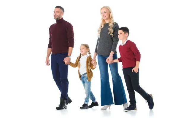 Familia feliz cogida de la mano con los niños, aislado en blanco - foto de stock