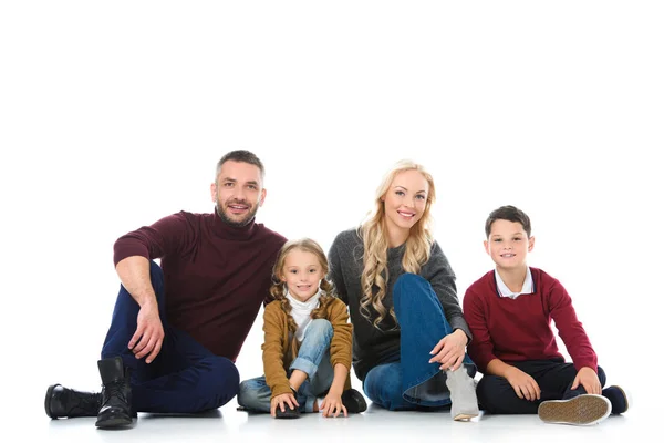 Parents sitting together with kids, isolated on white — Stock Photo