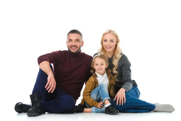 Family and daughter sitting in winter outfit, isolated on white — Stock Photo