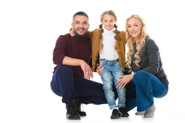 Genitori felici che si abbracciano con figlia, isolati su bianco — Foto stock