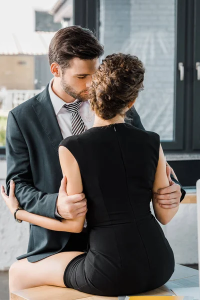 Sexy couple of business colleagues at workplace in office — Stock Photo