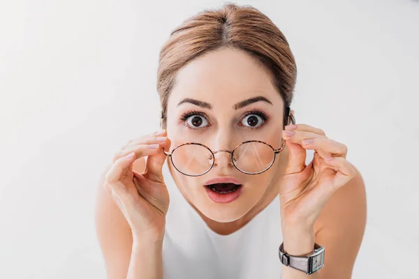 Top view of shocked stylish businesswoman looking at camera on white — стоковое фото