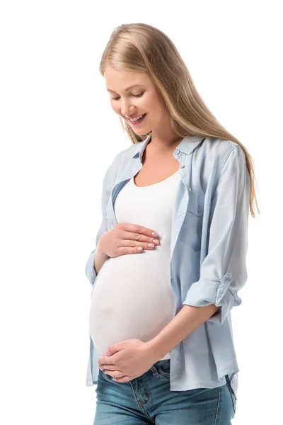 Щаслива вагітна жінка в повсякденному одязі ізольована на білому — стокове фото
