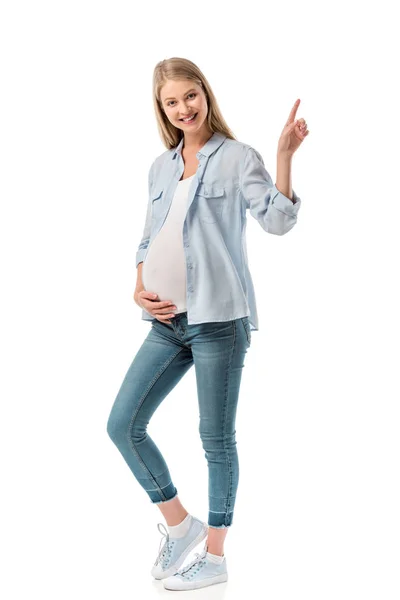 Happy pregnant woman pointing at blank space isolated on white — Stock Photo