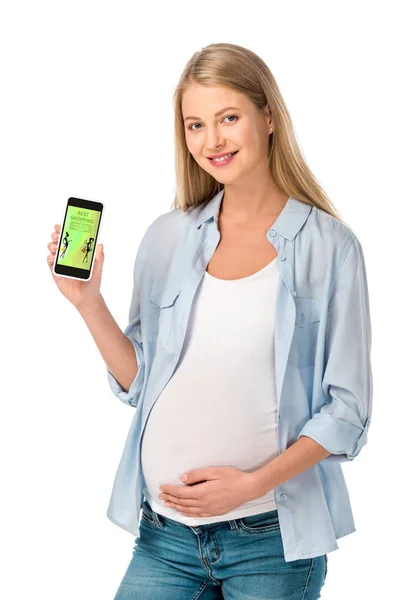 Mujer embarazada mostrando teléfono inteligente con la mejor aplicación de compras aislado en blanco - foto de stock