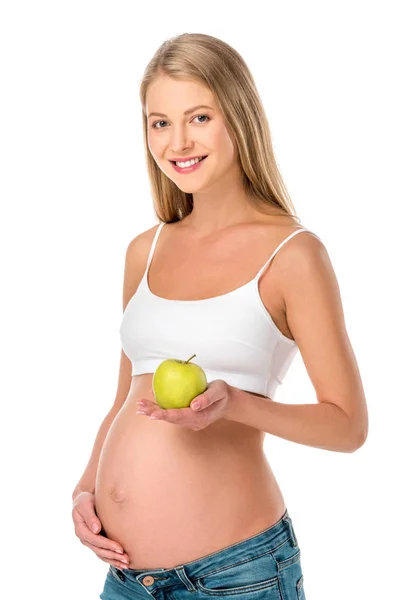 Красивая беременная женщина держит зеленое здоровое яблоко изолированы на белом — стоковое фото