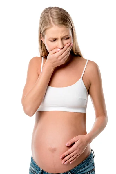 Mulher grávida em sutiã branco com náuseas isoladas em branco — Fotografia de Stock