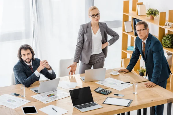 Serious insurance workers having discussion at meeting in office — Stock Photo