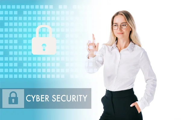 Portrait of smiling businesswoman in formal wear pointing at cyber security sign isolated on white — Stock Photo