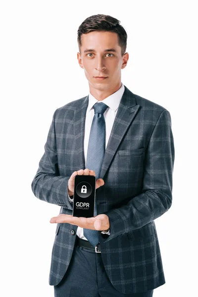 Portrait of businessman in suit showing smartphone with gdpr cyber security sign on screen isolated on white — Stock Photo