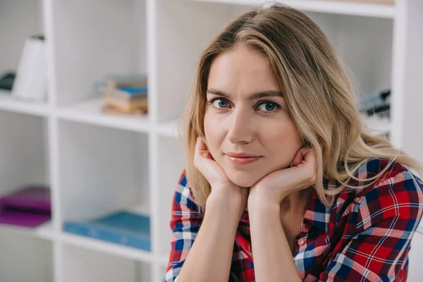 Portrait of beautiful woman looking at camera at home — Stock Photo