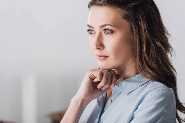 Close-up portrait of thoughtful adult woman looking away — Stock Photo