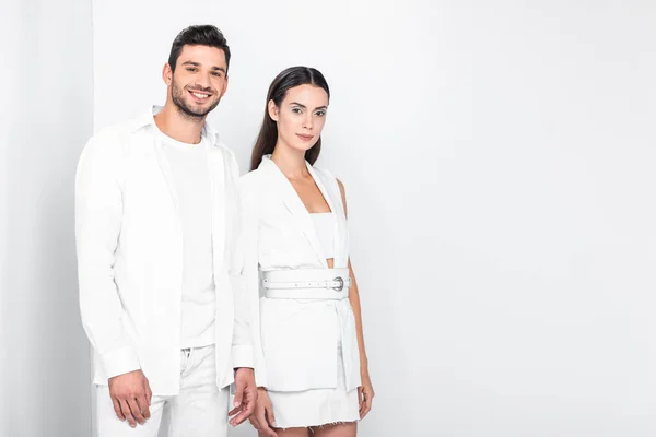 Adult stylish smiling couple in total white — Stock Photo