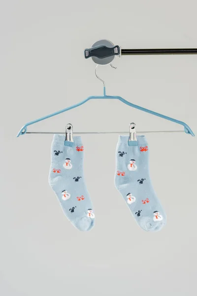 Pair of blue cotton socks with winter pattern isolated on grey — Stock Photo