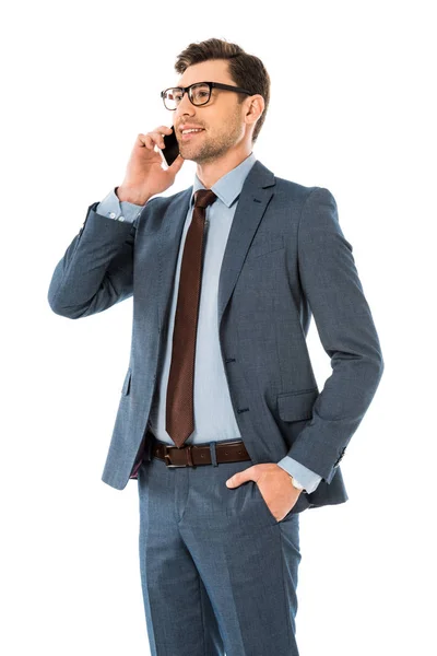 Adult businessman talking on smartphone isolated on white — Stock Photo