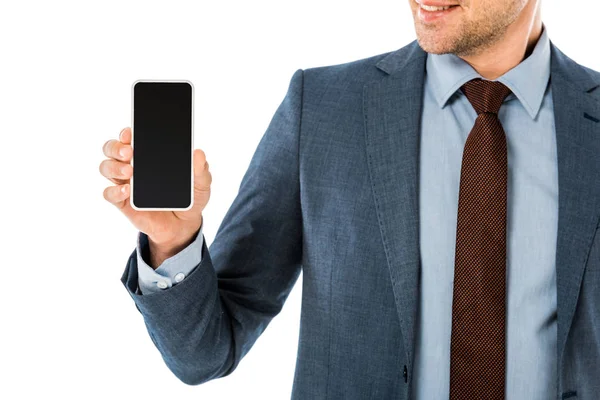 Close up of businessman in suit holding smartphone with blank screen isolated on white — Stock Photo