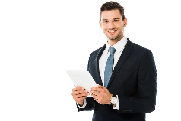 Guapo sonriente hombre de negocios sosteniendo tableta digital aislado en blanco - foto de stock