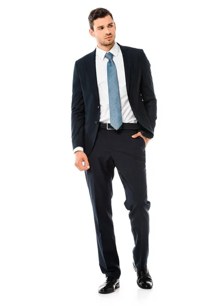 Serious handsome businessman in suit standing isolated on white — Stock Photo