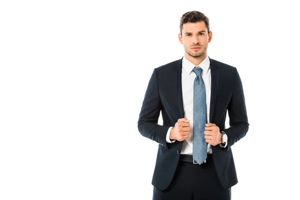 Confident handsome businessman in suit holding jacket isolated on white — Stock Photo