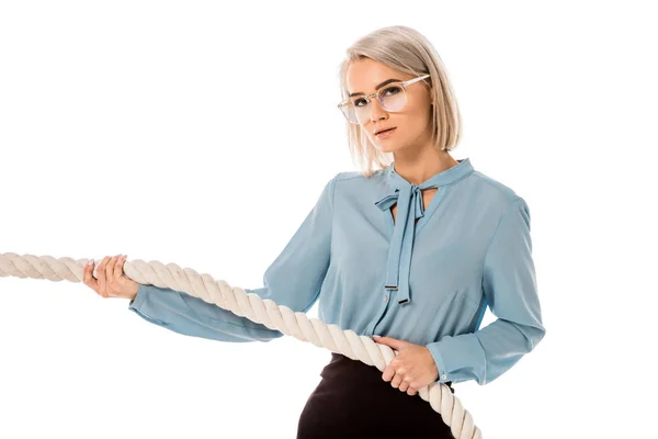 Beautiful blonde businesswoman in glasses pulling rope isolated on white — Stock Photo