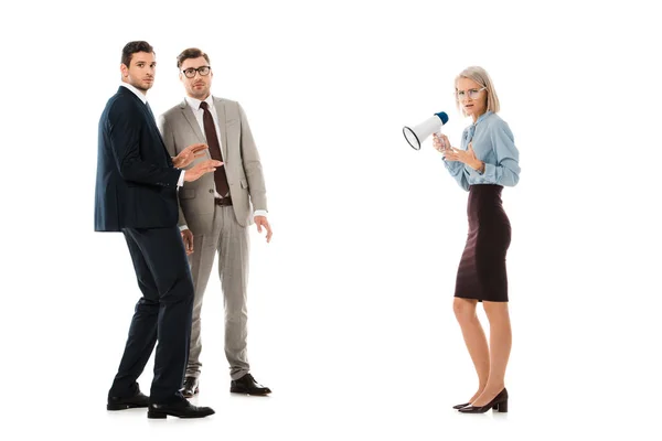 Dissatisfied businesswoman speaking in megaphone to colleagues isolated on white — Stock Photo