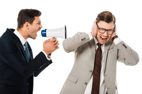 Angry boss shouting with loudspeaker at scared employee isolated on white — Stock Photo