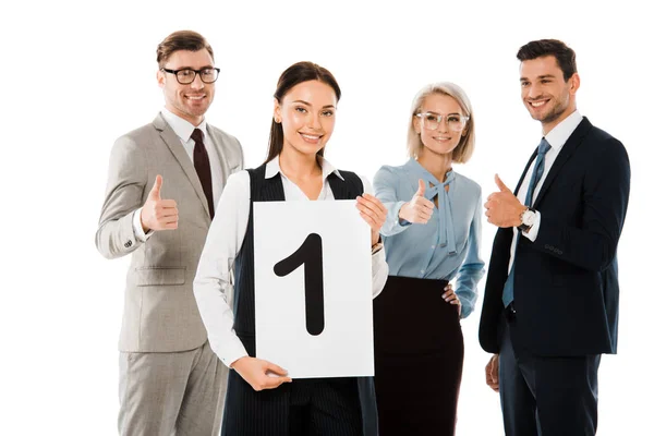 Female leader holding placard with number one while colleagues showing thumbs up isolated on white — Stock Photo