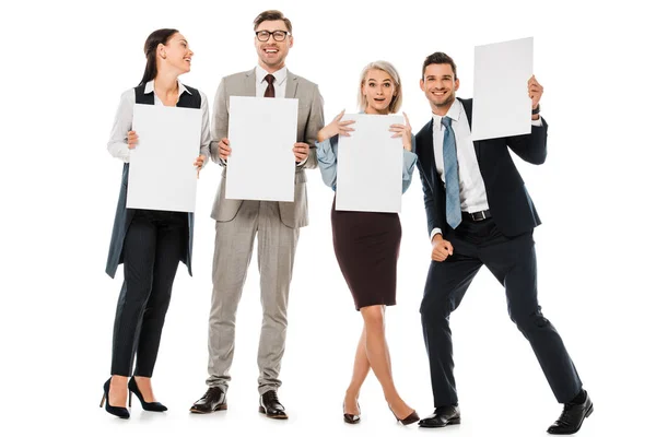 Cheerful businesspeople holding empty boards isolated on white — Stock Photo