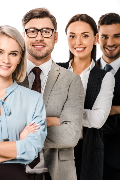 Smiling business team posing with crossed arms isolated on white — Stock Photo