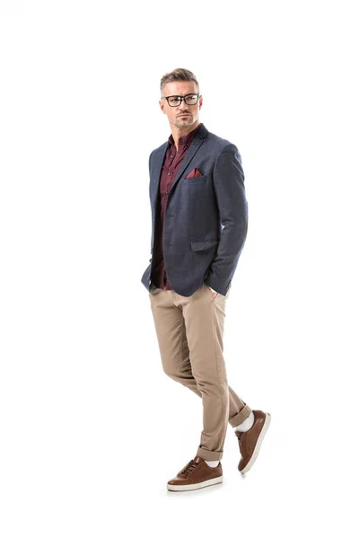 Handsome adult stylish man in eyeglasses and jacket posing isolated on white — Stock Photo