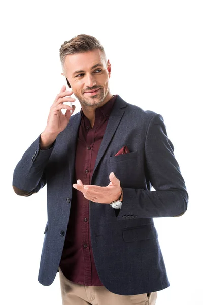 Stylish man gesturing by hand while talking on smartphone isolated on white — Stock Photo