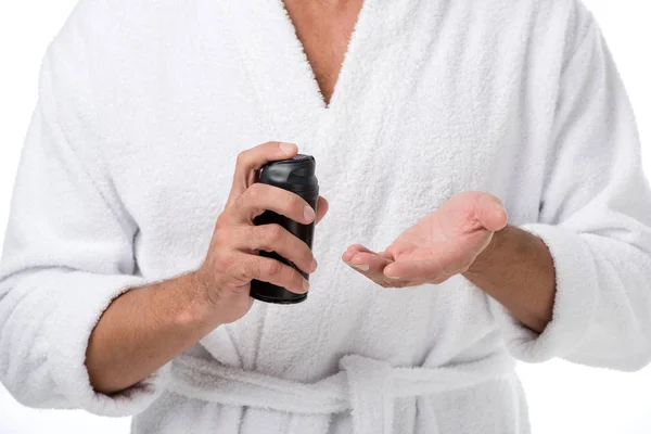 Cropped shot of man in bathrobe using shaving foam isolated on white — Stock Photo