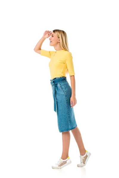 Side view of smiling girl with hand on forehead looking away isolated on white — Stock Photo