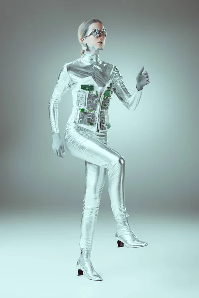 Full length view of futuristic cyborg walking on grey, future technology concept — Stock Photo