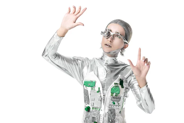 Silberroboter sieht etwas Isoliertes auf weißem, zukünftigem Technologiekonzept — Stockfoto
