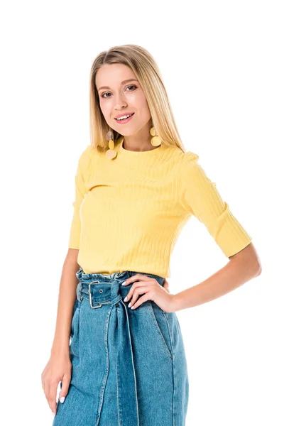 Attractive woman posing in yellow shirt and looking at camera isolated on white — Stock Photo