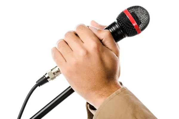 Обрезанное изображение мужчины музыканта, держащегося за руки на микрофоне, изолированном на белом — стоковое фото