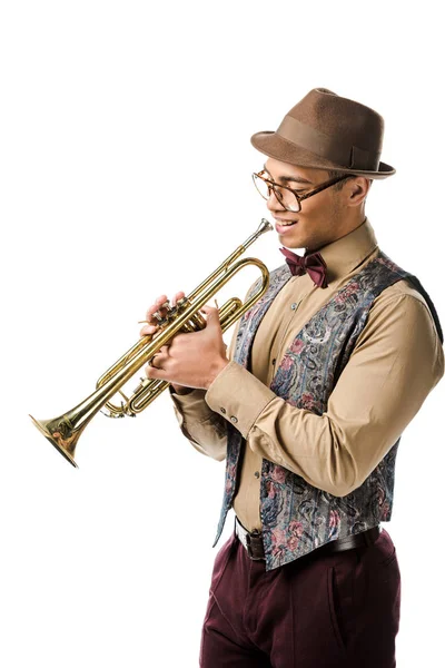 Happy young mixed race male jazzman posing with trumpet isolated on white — Stock Photo