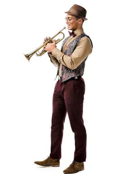 Handsome young mixed race male jazzman posing with trumpet isolated on white — Stock Photo