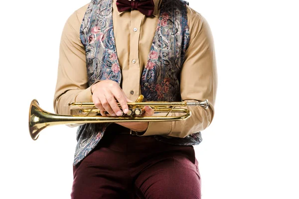 Partial view of male jazzman holding trumpet and sitting on chair isolated on white — Stock Photo