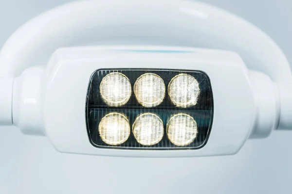 Close up of modern surgical lamps with lights in dental clinic — Stock Photo