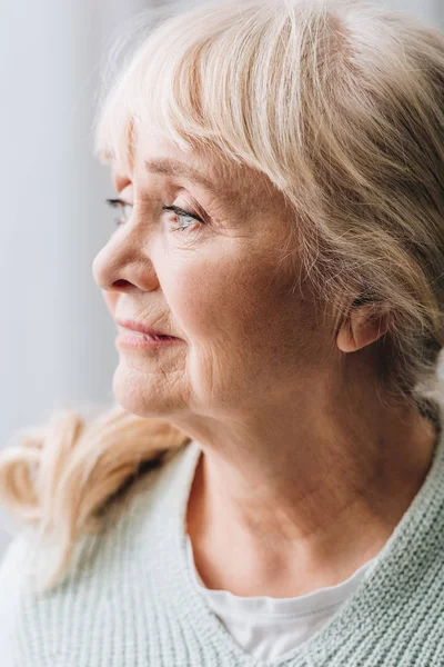 Close up of sad retired woman with dementia disease — Stock Photo