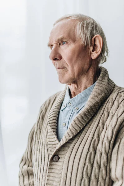 Sad retired man with dementia disease at home — Stock Photo